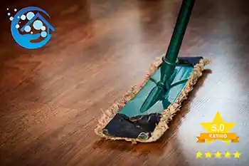 a woman cleaning the floor