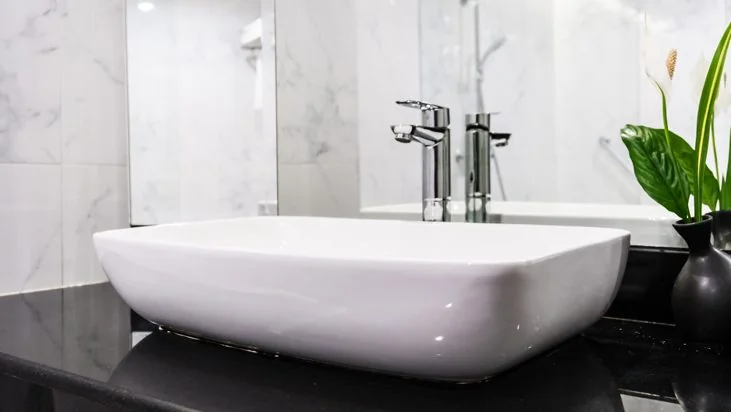 Clean bathroom vanity with a white sink